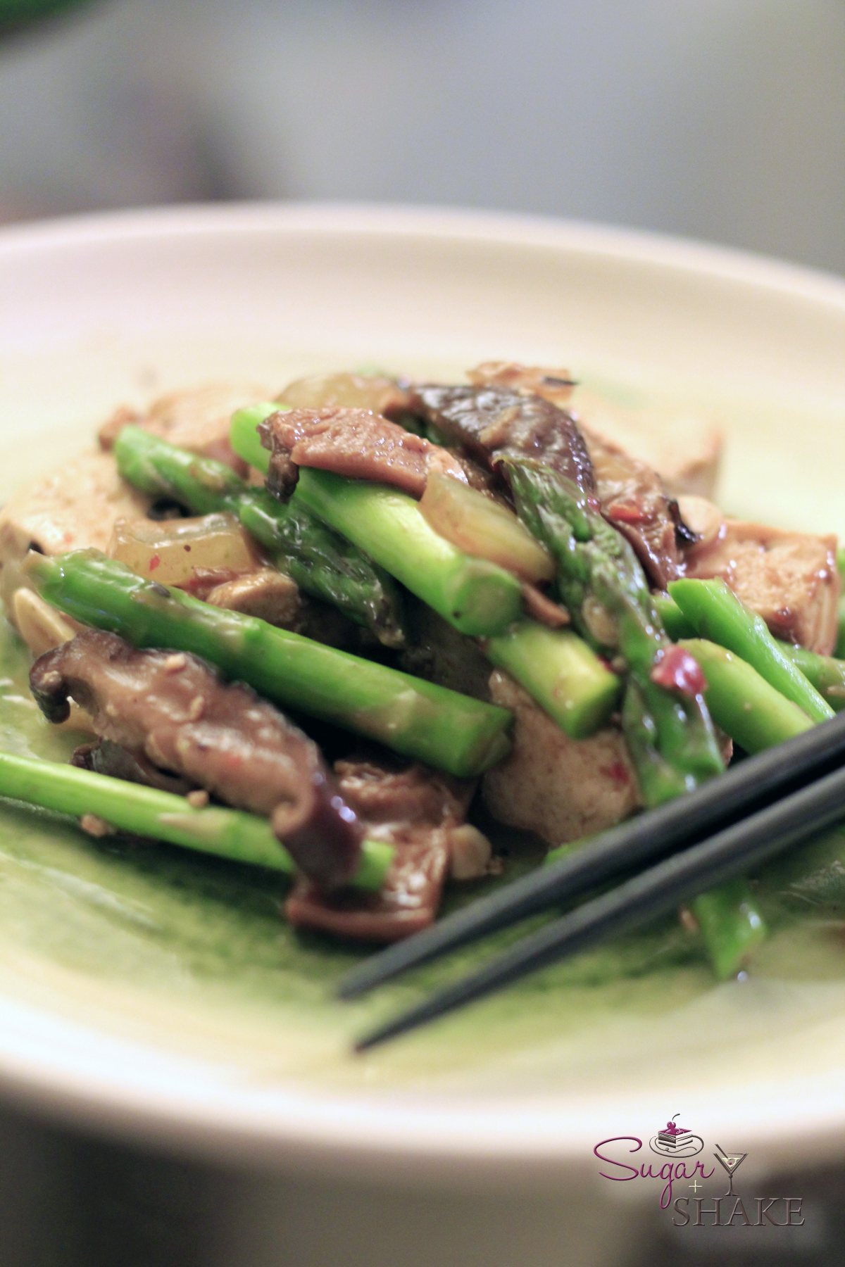 Our meatless adventure: Tofu, asparagus, shiitake mushrooms, onions and a LOT of garlic stir-fried in a black bean and to ban jian sauce. © Sugar + Shake