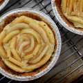 Apple and pear slices set in a rose pattern into an almond custard filling. Graham cracker crust. © 2012 Sugar + Shake
