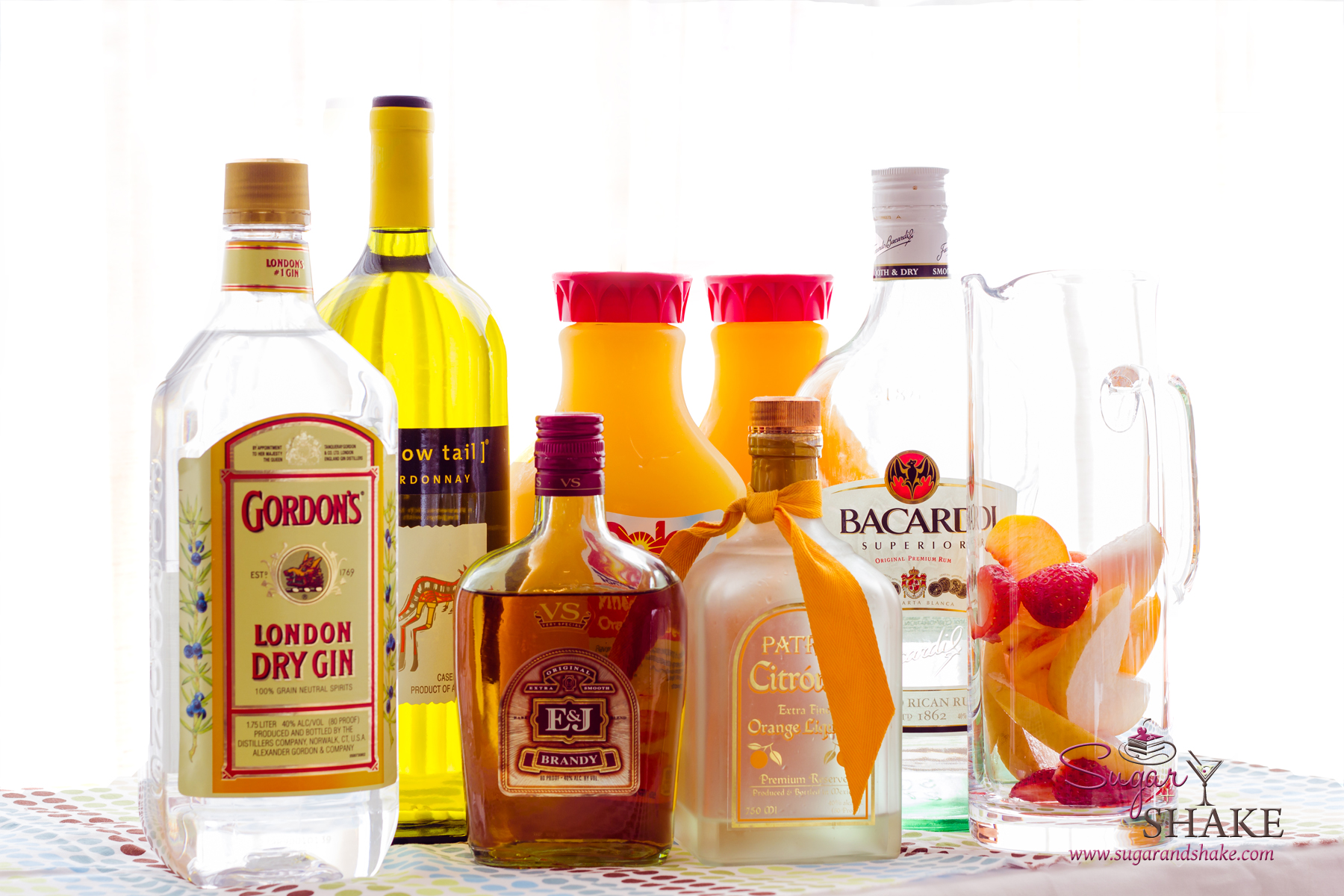 Yes, you need all this for a tasty sangria: Wine, gin, brandy, orange liqueur, rum, juice, fruit. © 2013 Sugar + Shake